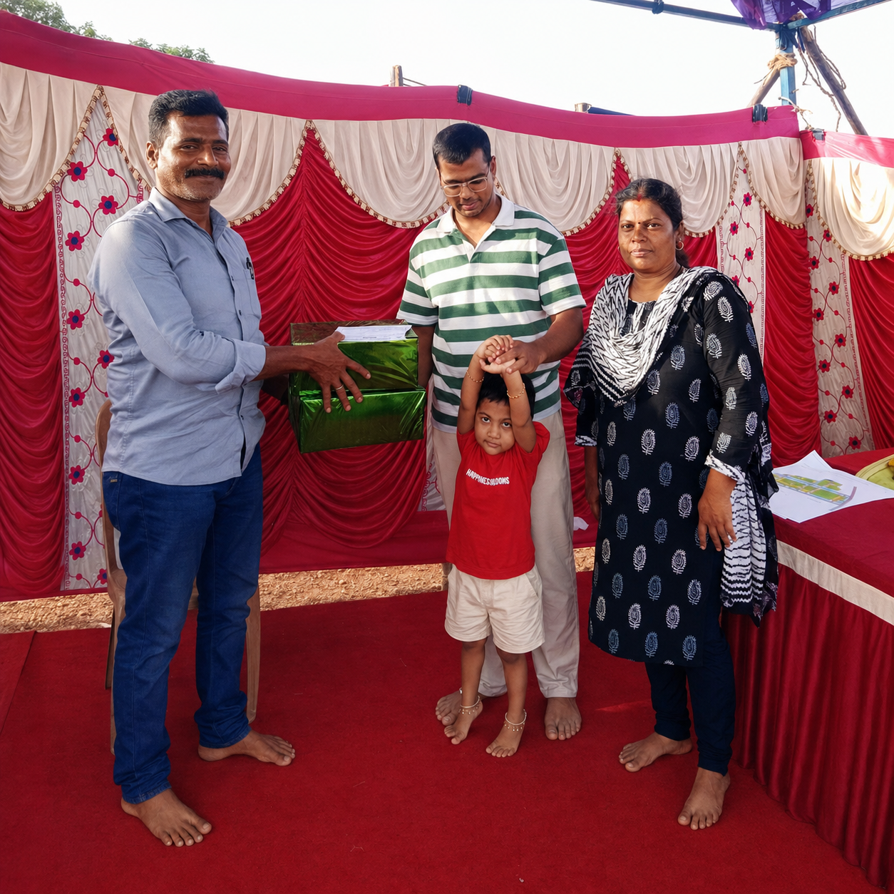 Happy customer celebrating their plot purchase at Sana Garden with Ganesh Land Developers
