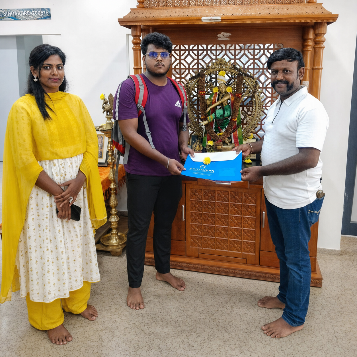 Happy customer celebrating their plot purchase at Big Boss Township with Ganesh Land Developers