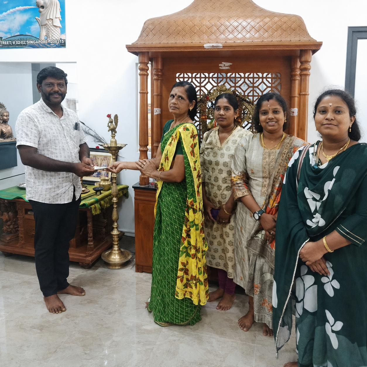 Happy customer celebrating their plot purchase at Dream Township with Ganesh Land Developers
